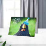 Cartão Funny Sea-hawk Bird•Happy Birthday<br><div class="desc">Blue-eyed,  black seahawk with his cute goldfish for his gift dawns a blue fuzzy and funny birthday hat.  Inside well wishes for a birthday,  which can be customized.  See templates at right for your convenience.</div>