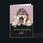 Cartão getting older, happy birthday, funny dog, pink hat<br><div class="desc">Send humorous birthday wishes to that friend or family member who's (nearly) over the hill with this funny Birthday card featuring a bulldog wearing a purple hat with a glass of champagne. You can edit text inside card yourself. Custom requests welcome!</div>