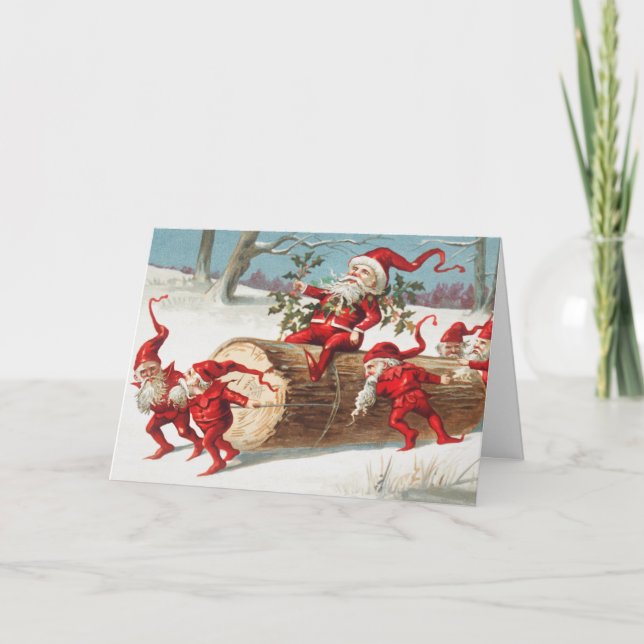 Cartão Gnomes dragging a cut tree trunk through the snow (Frente)