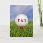 Cartão golf ball on tee for Dad's birthday<br><div class="desc">close up of golf ball on red tee in green grass for Dad's birthday</div>