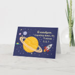 Cartão Grandson Birthday Planets in Outer Space, Rocket<br><div class="desc">Wish your grandson a happy birthday that is out of this world! Saturn is seen in the golden yellow color with stars and other planets surrounding it. A rocket ship has just blasted off to wish happy birthday.</div>