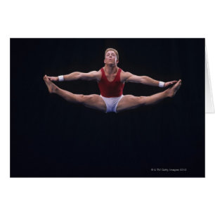 Cartão Gymnast masculino que executa no exercício de