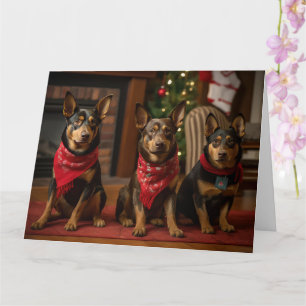 Cartão Kelpie Australiano junto à Lareira Natal