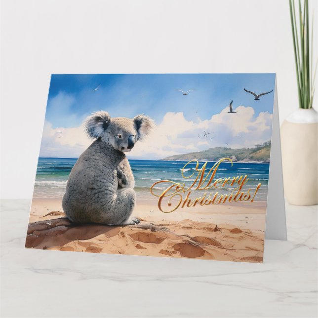 Cartão Koala em uma praia arenosa Feliz Natal (Frente)