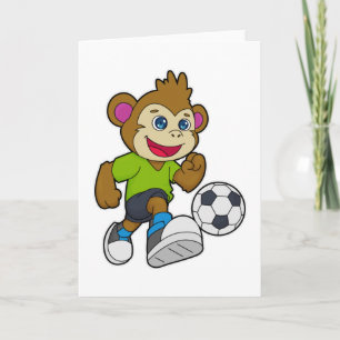Cartão Macaco como jogador de futebol com bola de futebol