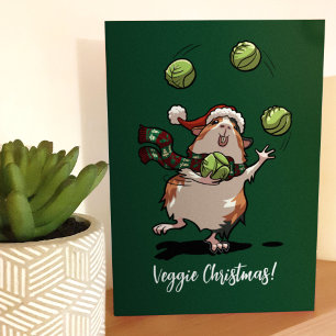 Cartão Natal vegetariano! Porquinho-da-índia fazendo mala