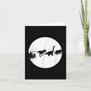 Cartão Papai Noel e seu passeio de trenó com dinossauros,