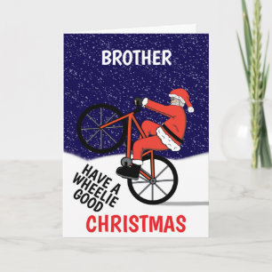 Cartão Papai Noel engraçado de bicicleta no Natal Alegre