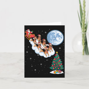 Cartão Papai Noel engraçado montando um cão pastor alemão