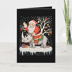 Cartão Papai Noel Montado em Rinoceronte Neve Luzes de Na
