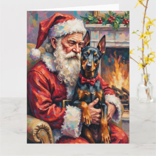 Cartão Papai Noel segurando a arte de Natal do Doberman