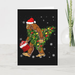 Cartão Pé Grande Carregando Árvore de Natal Crença