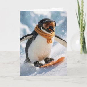 Cartão Pinguim de Natal descendo a ladeira de snowboard