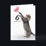 Cartão playful tabby cat for 6th birthday card<br><div class="desc">Gray tabby cat with pink heart balloon for 6th birthday on white background.
Background color can be changed</div>
