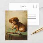 Cartão Postal A Dachshund Puppy | Carl Reichert<br><div class="desc">A Dachshund Puppy (1888) | Carl Reichert’s A Dachshund Puppy is a delightful portrait featuring a small brown dachshund puppy perched on a wooden stool. The artwork captures the puppy’s curious and innocent expression with exquisite detail, from the soft texture of its fur to the subtle shading of its surroundings....</div>