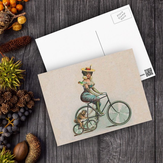 Cartão Postal Bicicleta Dog Vitage Victorian (Victorian lady riding a bicycle beside her bulldog riding a bicycle on a tan postcard.)