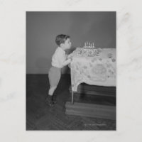 Boy Blowing Out Candles