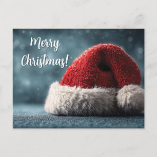 Cartão Postal Chapéu de Papai Noel apoiado em Superfície Nevada 