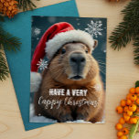 Cartão Postal De Festividades Muito Cappy Natal Capybara Natal<br><div class="desc">Mande uma alegria de Natal da Capy nesta temporada de festas com este cartão de Natal engraçado com o animal de frio favorito de todos - a capybara! Escondida num chapéu festivo de Santa e rodeada por flocos de neve, esta carta traz uma dose extra de humor para os seus...</div>