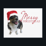 Cartão Postal De Festividades Papais noeis Feliz de Natal<br><div class="desc">Um belo cartão-postal de férias para amantes de cães,  com um adorável pembroke welsh corgi vestindo um chapéu vermelho de santa. Feliz Natal está escrito em vermelho ao lado da fotografia bonitinha.</div>