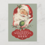 Cartão Postal De Festividades Santa Most Wonderful Time For A Beer Christmas<br><div class="desc">Funny retro winking Santa Claus design "It's the most wonderful time for a beer" Christmas greeting postcard.  Reverse side of card is coordinating red and can be pre-printed with your return address. A budget friendly Christmas greeting card to spread cheer to your friends and family this season.</div>