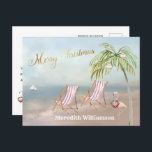Cartão postal de Natal de Beach Flamingo Merry<br><div class="desc">Feliz Natal nesta adorável praia Watercolor — uma cena pacífica e gentil com duas cadeiras de praia — um flamingo amigável com uma bela coroa — Palmeira com alguns ornamentos. Também disponível em diferentes pesos de papel — sua seleção.</div>