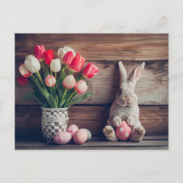 Cartão Postal Easter bunny seated beside colorful eggs and tulip