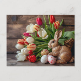 Cartão Postal Easter bunny seated beside colorful eggs and tulip