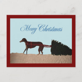 Cartão Postal Greyhound puxando uma árvore de Natal pela neve