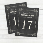 Cartão Postal Número de Tabela de Casamento de Quadro Preto de V<br><div class="desc">A placa de número de tabela chic rustic apresenta um giz manuscrito branco esbranquiçado sobre um fundo de conselho preto no estilo texturizado. Inclui uma fronteira floral e estriada vintage e um monograma de casamento dos nomes da noiva e noiva e a data de casamento acima do número da tabela....</div>