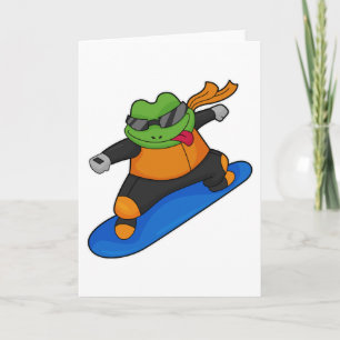 Cartão Rã como praticante de snowboard com prancha de sno