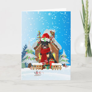 Cartão Rottweiler na neve com presentes de Natal