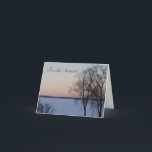 Cartão Seasons Greetings Wisconsin Winter Lake Christmas<br><div class="desc">Tis the season to celebrate the quiet tranquil magic of nature in winter. Photograph shows trees on the side of a frozen lake covered in snow. the sky is aglow in a soft orange with the fall of evening twilight. Scene is in Wisconsin, in a wide open midwestern sky. Front...</div>