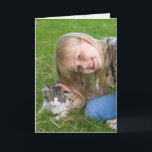 Cartão smiling girl with kitten birthday<br><div class="desc">Little girl petting tabby kitten in grass for general birthday.</div>