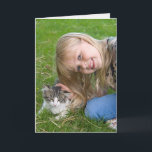 Cartão smiling girl with kitten birthday<br><div class="desc">Little girl petting tabby kitten in grass for general birthday.</div>