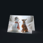 Cartão Snowman De Natal Com Cachorro Irlandês<br><div class="desc">Um boneco de neve e um cão Setter irlandês ambos vestindo lenços compartilham um momento de companhia em um cenário de floresta nevada</div>