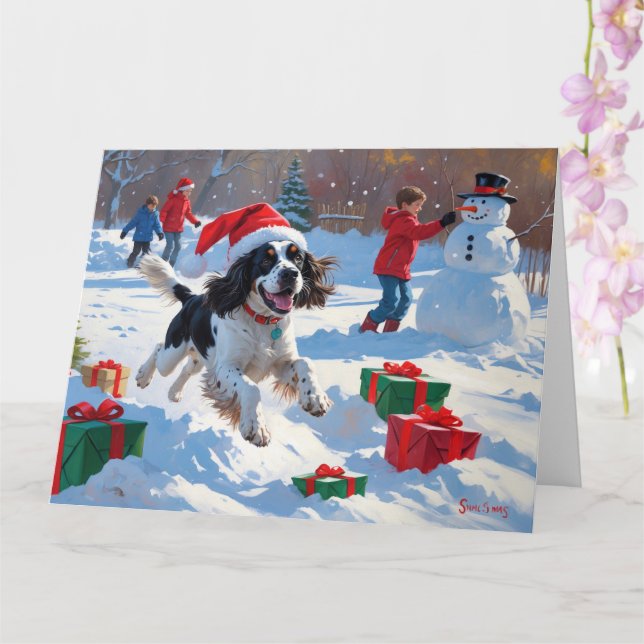 Cartão Springer Spaniel Correndo Neve com Chapéu de Natal (Orquídea)