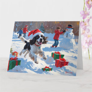 Cartão Springer Spaniel Correndo Neve com Chapéu de Natal
