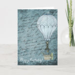 Cartão Steampunk Hot Air Balloon Dusk Blue Handwriting<br><div class="desc">Matches other Steampunk hot air balloon design items such as cards and wrapping paper. Great for aviators and other air travel fans. This design features a Victorian Steampunk Hot Air Balloon gently flying in front of a scrapbook background page filled with handwriting washed with shades of soft, dusk blue. This...</div>