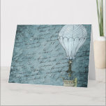 Cartão Steampunk Hot Air Balloon Dusk Blue Handwriting<br><div class="desc">Matches other Steampunk hot air balloon design items such as cards and wrapping paper. Great for aviators and other air travel fans. This design features a Victorian Steampunk Hot Air Balloon gently flying in front of a scrapbook background page filled with handwriting washed with shades of soft, dusk blue. This...</div>