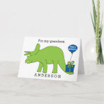 Cartão Triceratops Dinosaur Birthday Grandson<br><div class="desc">A triceratops dinosaur birthday grandson card with a Happy Birthday balloon attached to the present. You can easily personalize this kid's dinosaur birthday card with their name. Inside the birthday card reads "have a dino-mite birthday!" which you can also change if you'd like. The back reads "Happy Birthday 2018". Great...</div>