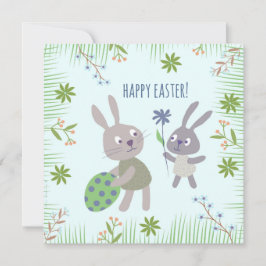 Cartão Twee paashaasjes met ei en bloem.