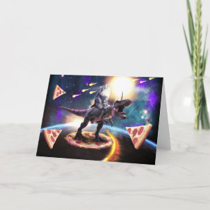 Cartão Um gato dirigindo unicórnio de dinossauro no espaç