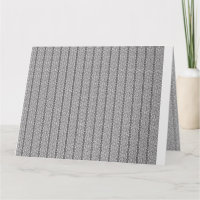 Um padrão geométrico branco e cinza preenche a ima