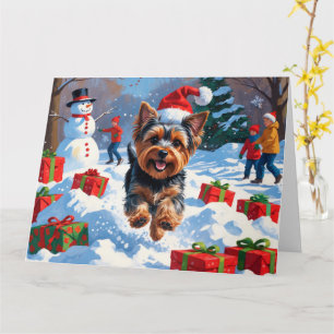 Cartão Yorkshire Terrier na Neve com Chapéu de Natal