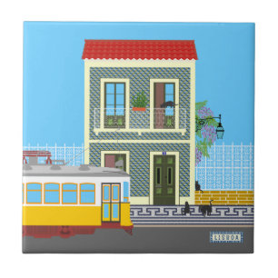 Casa velha de Lisboa com gatos e elétrico amarelo