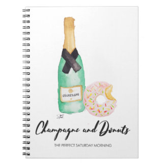 Champagne e caderno da aguarela das rosquinhas