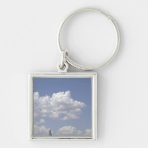 Chaveiro A CV- 22 Osprey voa sobre um Hércules C- 130