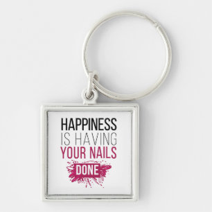 Chaveiro A felicidade bonito está tendo suas unhas feitas