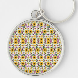 Chaveiro A round keychain with a floral pattern